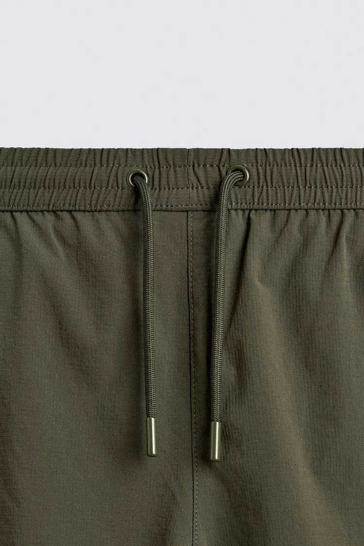 KORTE ZWEMSHORT MET STRUCTUUR